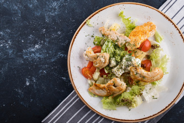 Tasty  chicken salad with vegetables, cheese and pineapple. Top view. Space for text