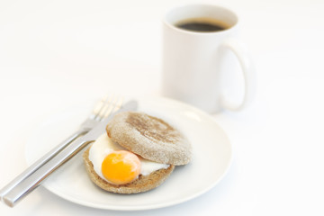 Egg Muffin and Cup of Coffee on white background