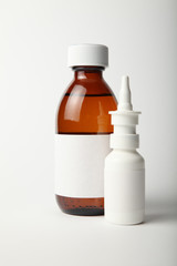 Medical glass bottle and spray mockup. Empty white label.