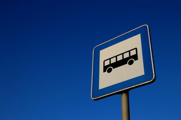 Blue traffic sign on blue sky