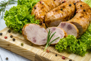 Sliced sausage on a cutting board close-up.