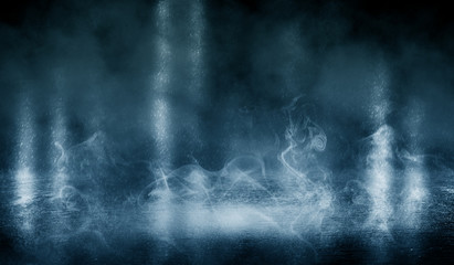 Black background of empty street, room, blue searchlight illuminates asphalt, smoke