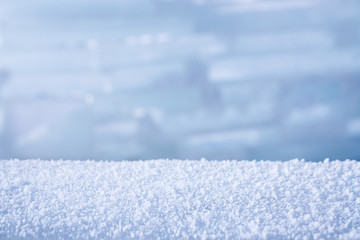 Fototapeta na wymiar Winter background with snow and blurred bokeh
