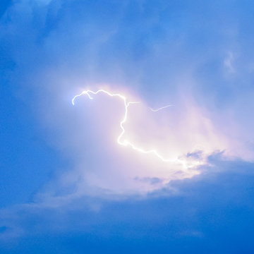Lightnings in storm clouds. Peals of a thunder and the sparkling