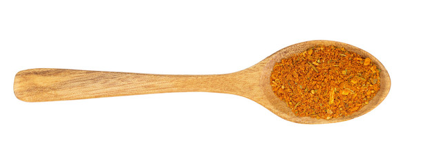Mixed spices on wooden spoon isolated on white background. Top view. Flat lay