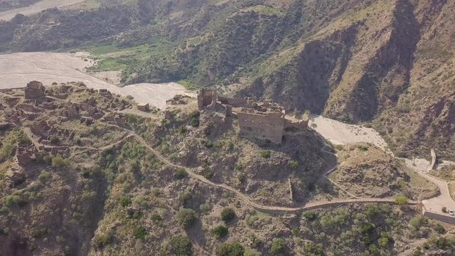 Cinematic lateral 4k drone aerial footage of the ghost town of Amendolea, Calabria, Italy
