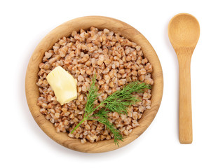 Buckwheat porridge in wooden bowl isolated on white background. Top view