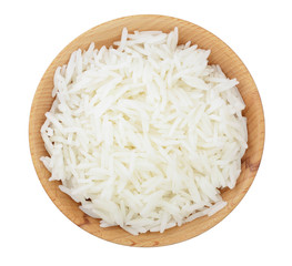 rice in a wooden bowl isolated on white background. Top view. Flat lay