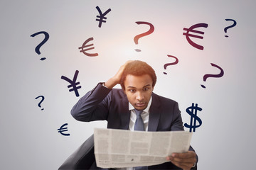 Shocked man with newspaper, currency problem