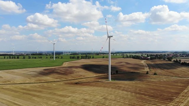 Summer. Wind power generators in the fields of Europe