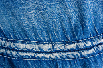 Blue washed faded jeans texture with seams