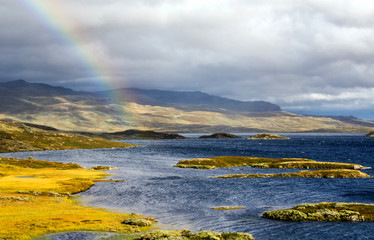 Lake in the prairies of the interior of southern Norway on a cloudy day.