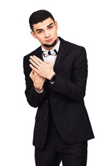 Serious strict businessman or boss in black suit shows gesture with his hands