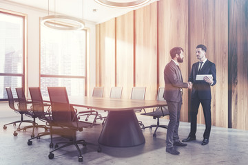 Fototapeta premium Dark wooden meeting room corner, people