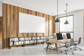 White and wooden office corner with poster