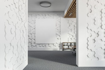 Poster on white hexagonal pattern office wall