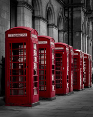 Red old English Phone boxes in a black and white setting