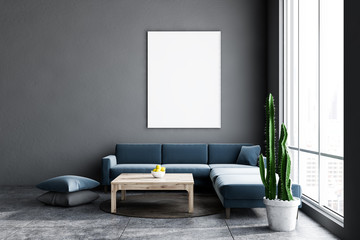 Gray living room, dark blue sofa and poster
