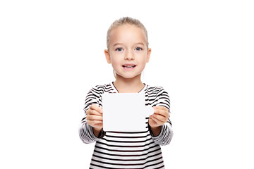 Young girl holding blank card infront of her. Speech therapy concept on white background. Correct pronounciation and articulation at preschool ag - obrazy, fototapety, plakaty