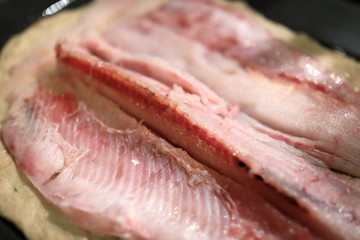 Fillet of muksun on dough