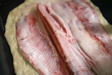 Muksun fillet on dough