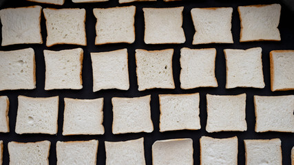 Toast of sliced bread on a black background.