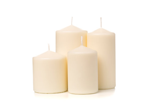 White candle on white background isolated. Set of wax candle