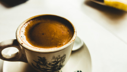 Closeup shot of cham coffee on white table 