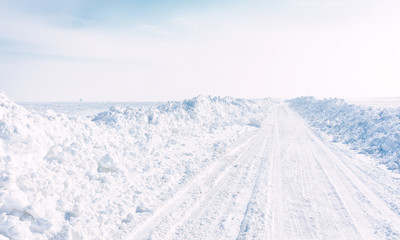 winter landscape with road and blue sky