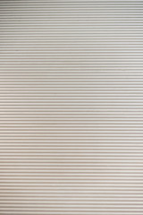 Texture of big white rolling steel door.