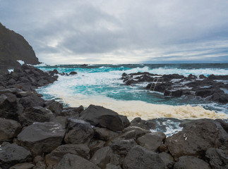 Ponta da Ferraria, natural thermal bath pool Termas da Ferraria, the place where hot springs fall into the ocean, big waves and sea foam, Sao Miguel island, Azores, Portugal