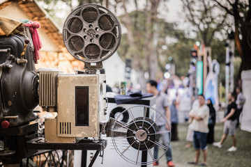 The old analog rotary film movie projector at outdoor cinema movies theater for show people in the...