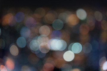 Bokeh of Bangkok street light from skyscraper / blur background / bokeh concept / festive background / nightlife