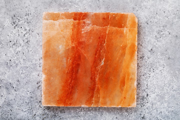 Himalayan salt tile on the table, top view. Food background