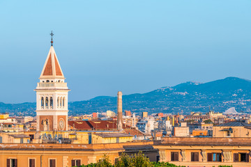 Historic Italian town of Rome, Italy cityscape skyline with high angle view of colorful architecture old buildings tower at sunset evening night