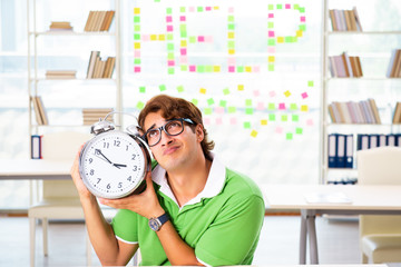 Student struggling at the exam in classroom