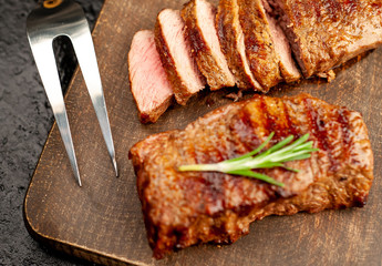 Beef steak on cutting board