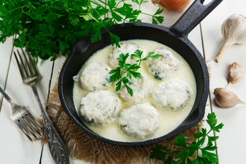 Chicken meatballs in milk sauce