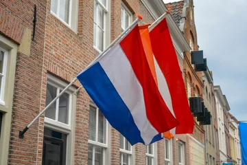 Fotobehang Traditional birthday celebration of King of the Netherlands Willem-Alexander, King's Day national holiday on April 27, Dutch flag © barmalini