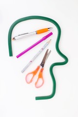 Abstract profile of man's head with stationery for design