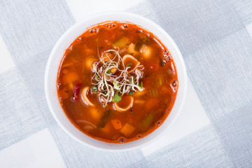 minestrone soup bowl with sprouts