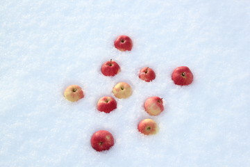 Red apples on snow