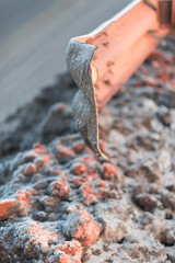 Winter highway with metal safety barrier