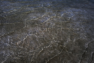 Glowing sea waves pattern in brown, blue and white