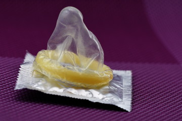 Condom textured on purple background