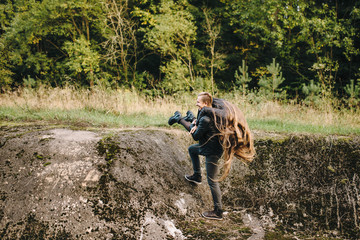 Love is in the air. Beautiful young couple embracing and smiling outdoors