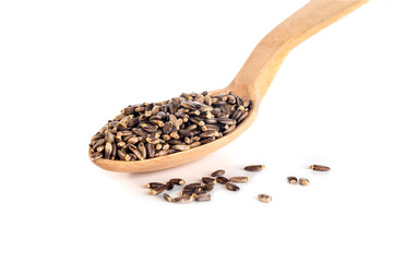 thistle seeds in a wooden spoon on a white background