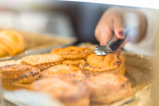 Person Taking A Salty Piece Of Meat To Sell It In A Bakery