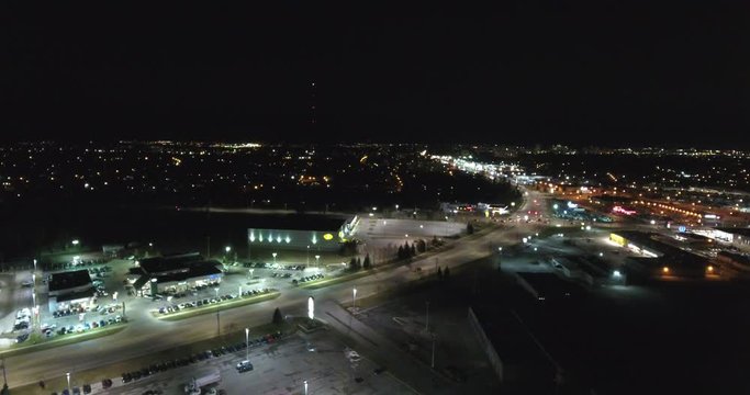 Traffic On Roads Near Shopping Center At Night