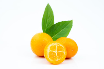Ripe kumquats on white background